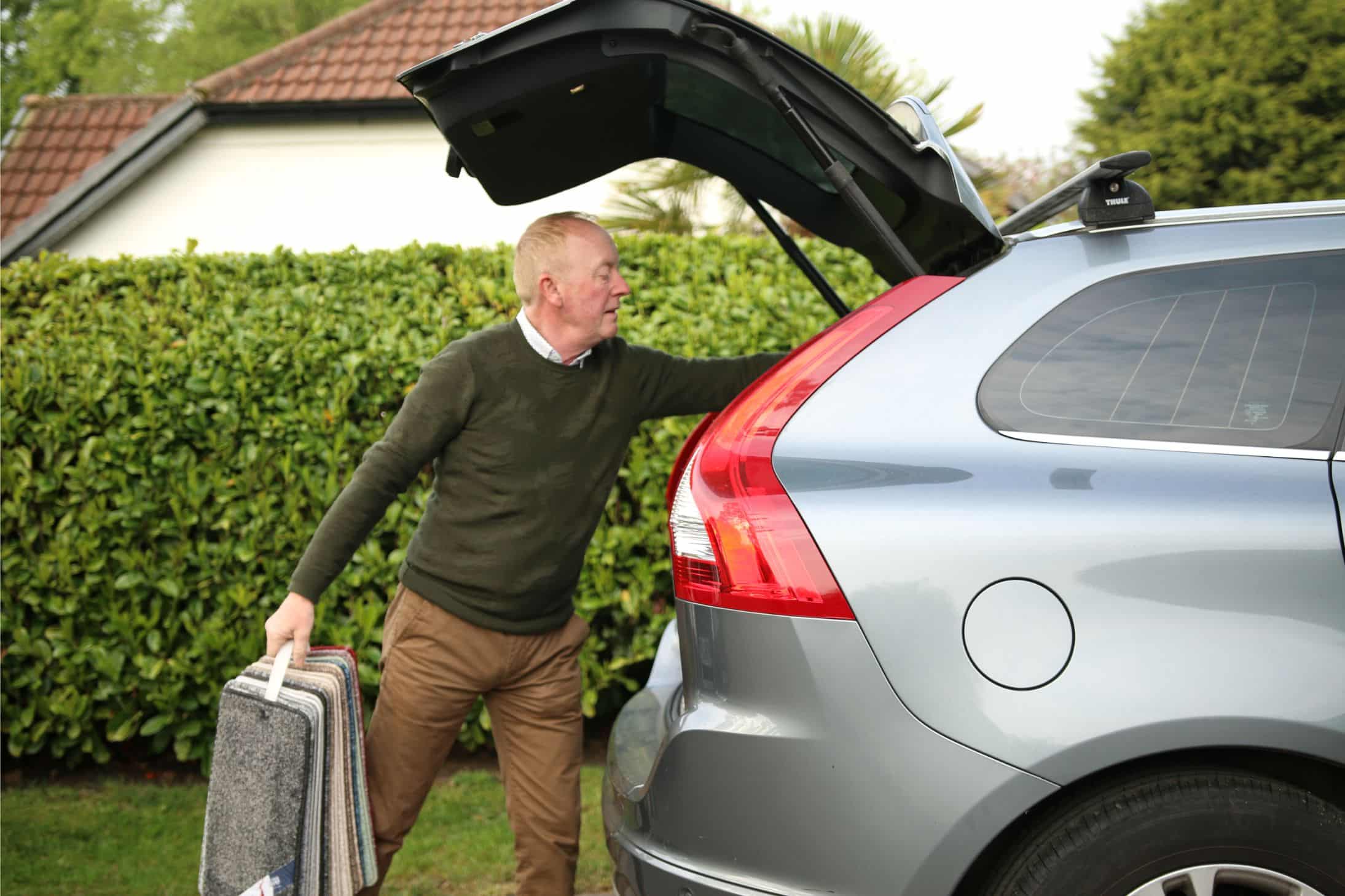 Paul Biesty taking carpet samples from vehicle